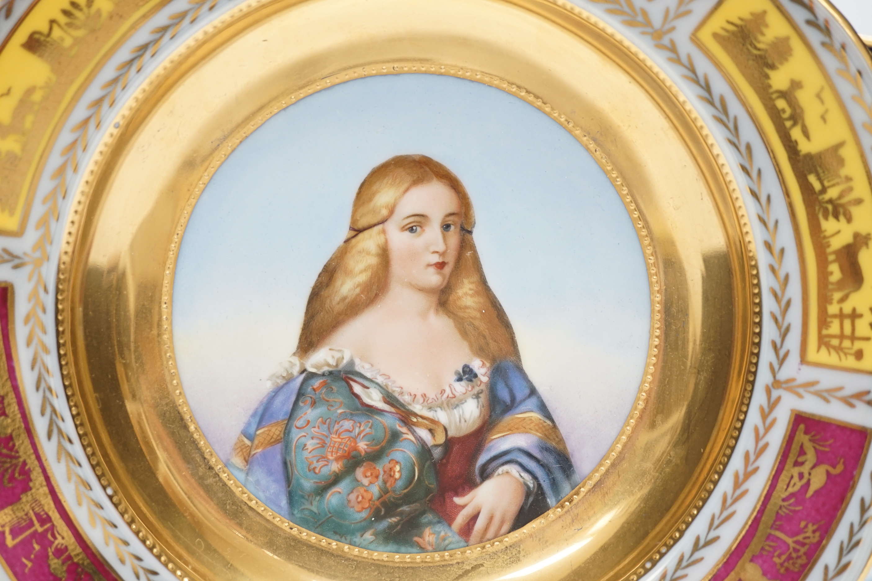 Two early 20th century Vienna style cabinet plates painted and enamelled with portraits and a Sevres style cabinet plate, 24cm (3)